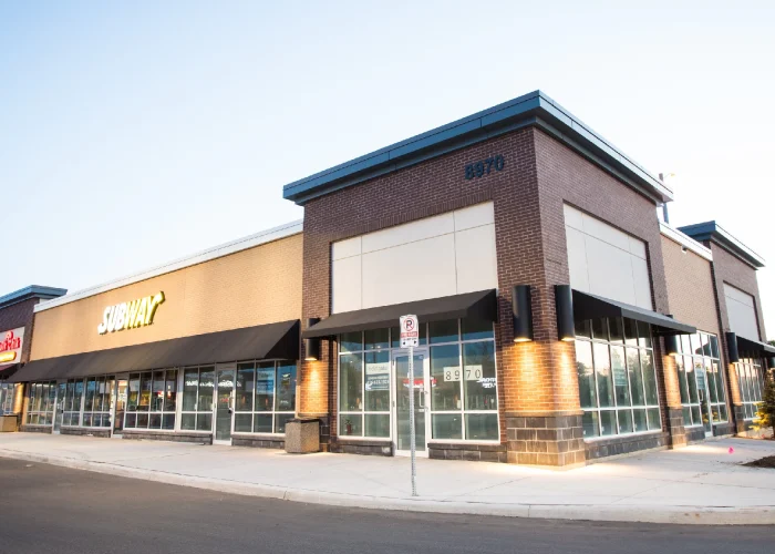 Chinguacousy Marketplace, Brampton – brick retail building at dusk with Subway sign