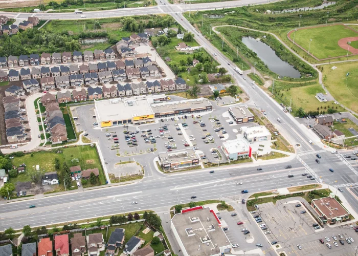 Chinguacousy Marketplace, Brampton – aerial view of the plaza at an intersection with houses and a park