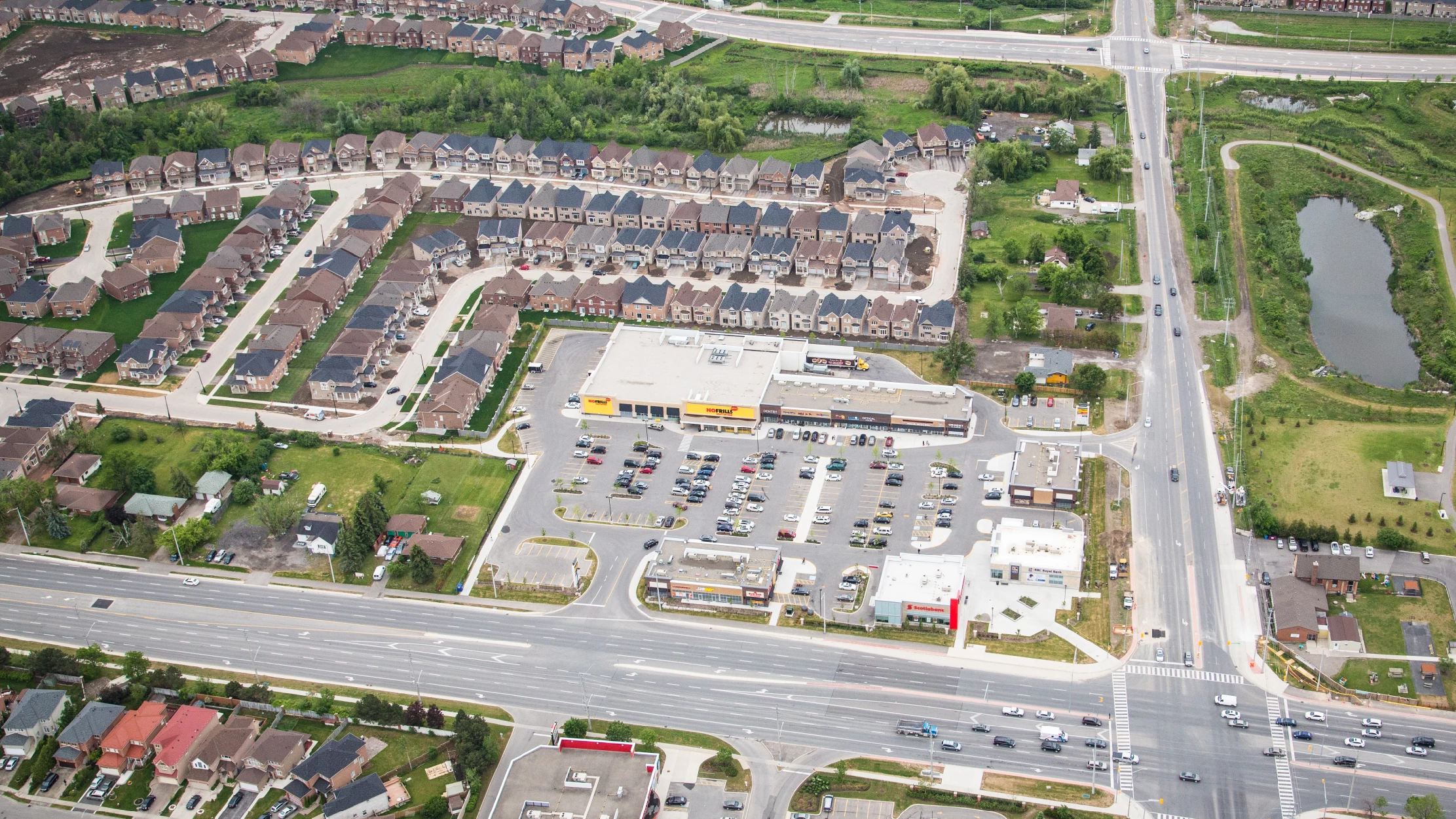 Chinguacousy Marketplace, Brampton – aerial view of the plaza at a major intersection beside houses