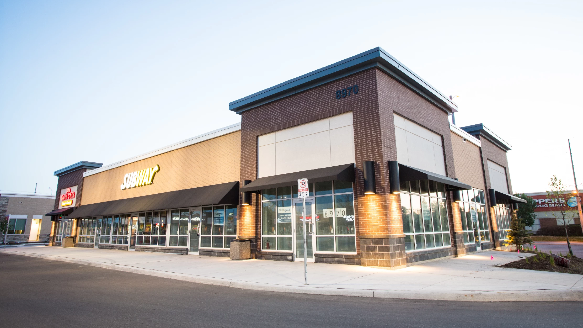 Chinguacousy Marketplace, Brampton – brick retail building at dusk with Subway sign