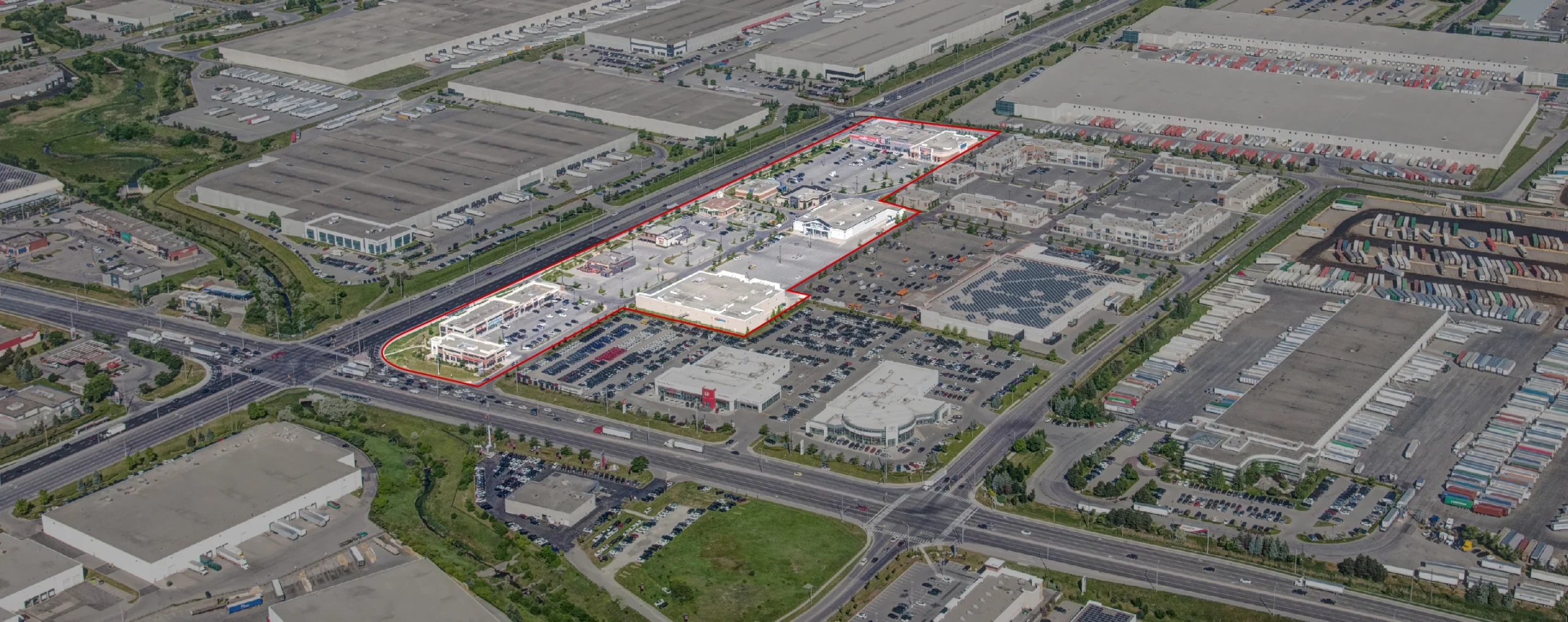Woodhill Centre, Brampton – aerial view of the plaza and industrial area, site outlined in red