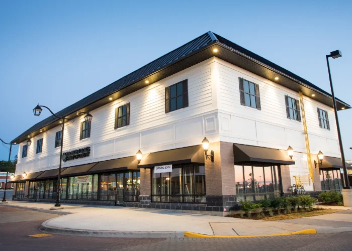 Yonge Green Lane Common, East Gwillimbury – two-storey white-clad building at dusk
