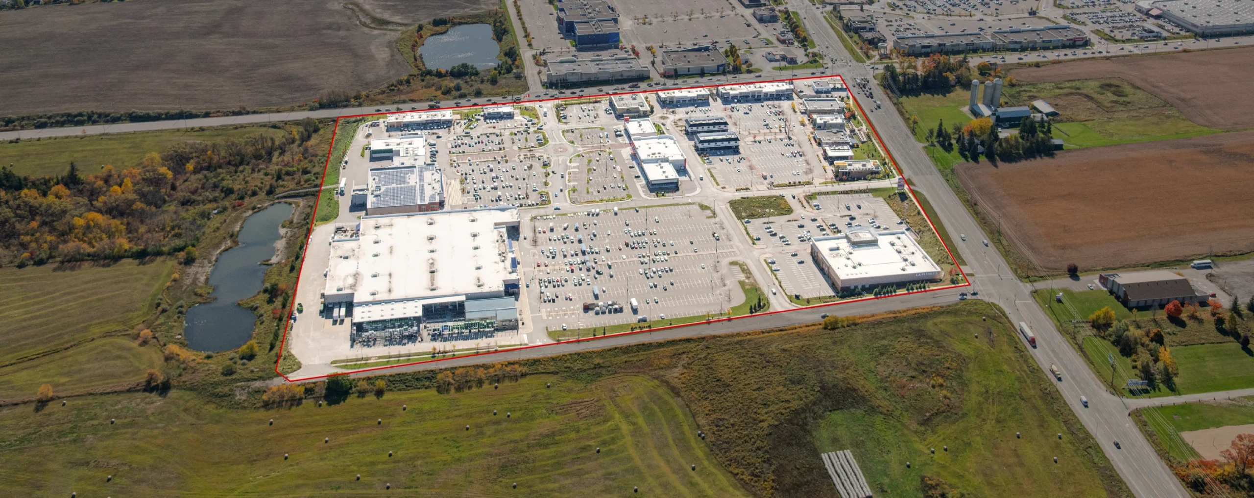Yonge Green Lane Common, East Gwillimbury – aerial view of the plaza surrounded by farmland
