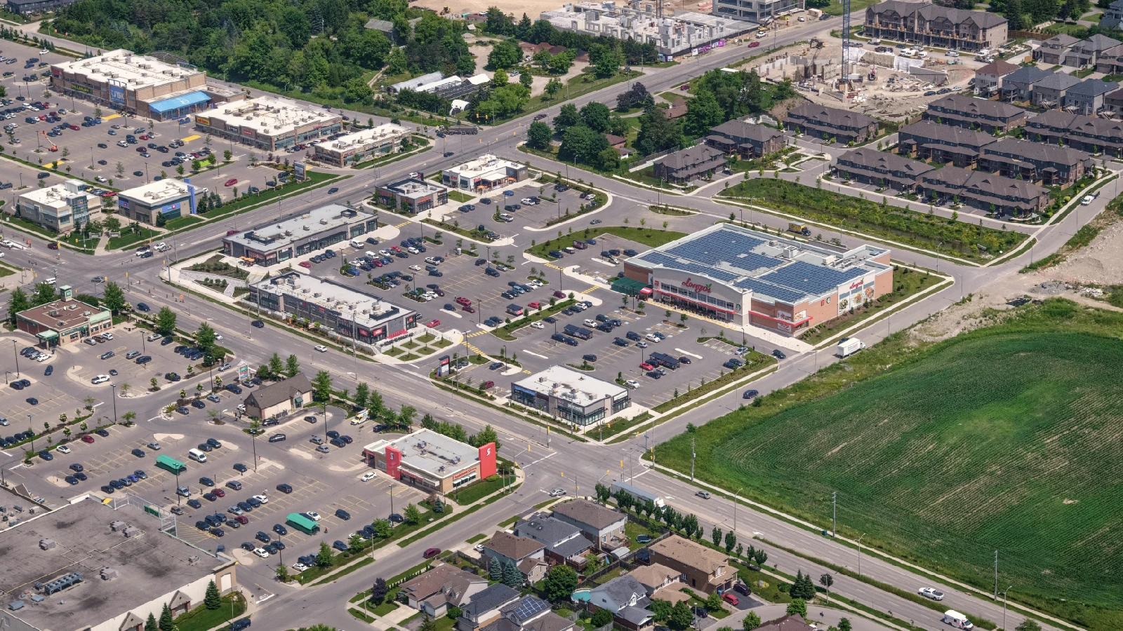 Clair Marketplace, Guelph – aerial view of the plaza, parking lot and surrounding buildings