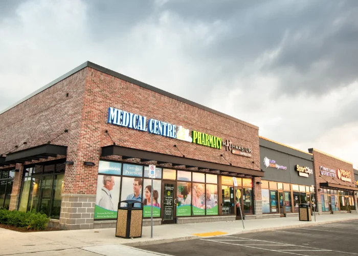 Willmott Marketplace, Milton – medical centre and pharmacy storefronts in a brick row
