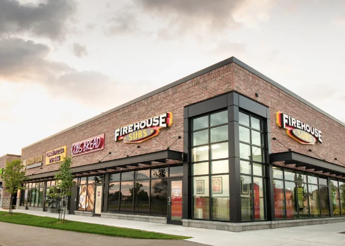 Willmott Marketplace, Milton – Firehouse Subs corner storefront at dusk