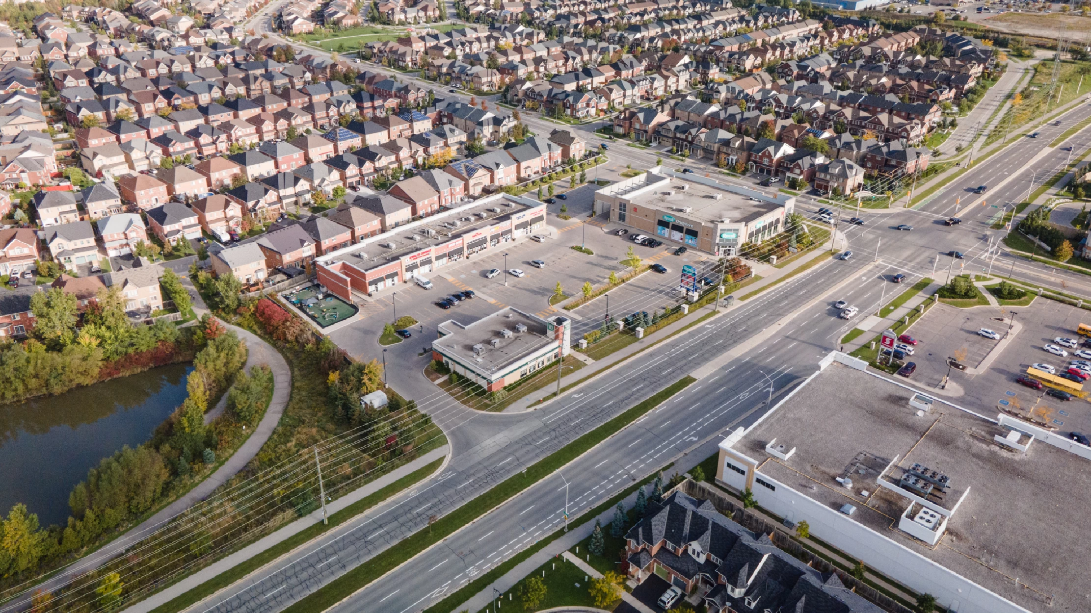 Derry Rd W & Scott Blvd, Milton – aerial view of the plaza, intersection and surrounding homes