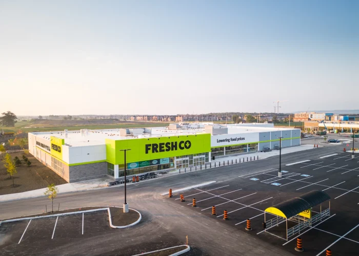 Mazmik Marketplace, Milton – aerial view of the FreshCo store and new parking lot
