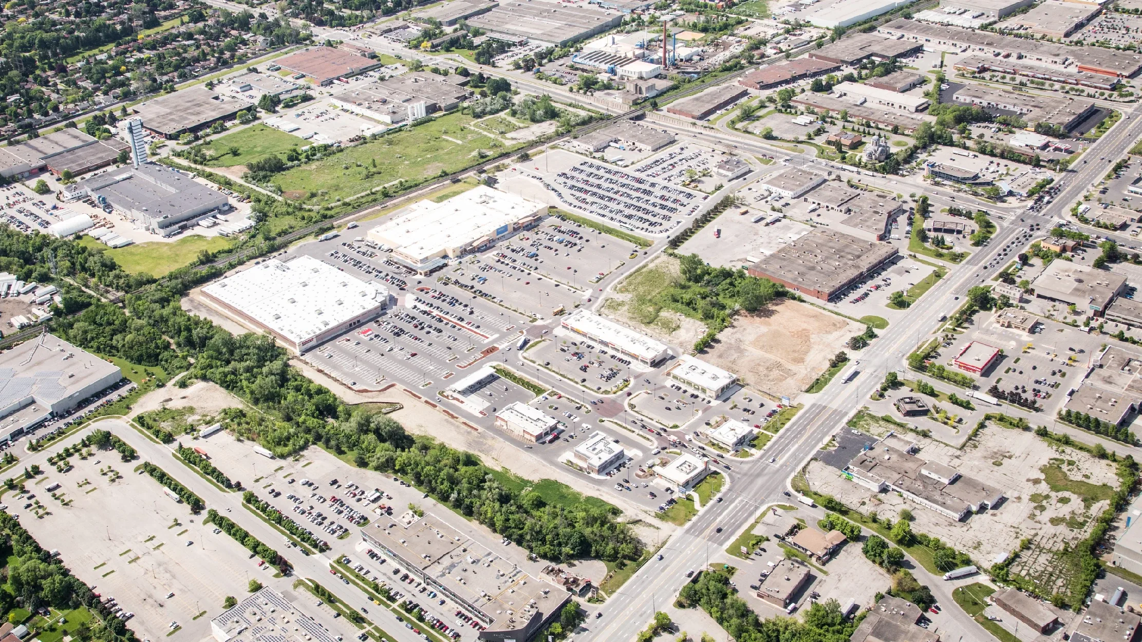 Creekside Crossing, Mississauga – aerial view of the plaza, parking lots and surrounding industrial area