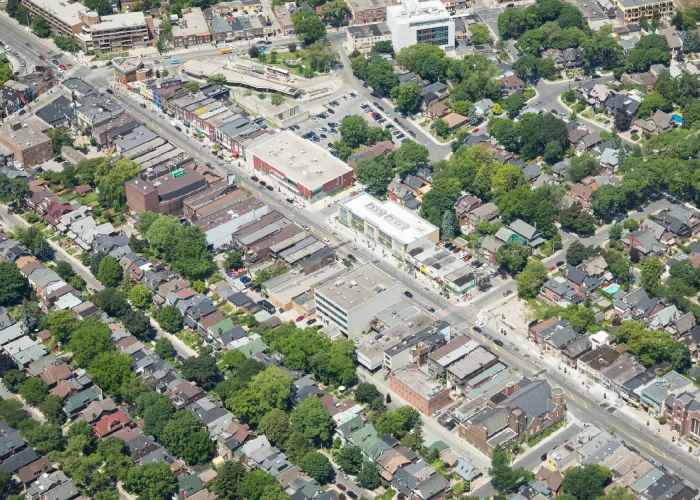 Danforth Ave & Ellerbeck St, Toronto – aerial view of a low-rise commercial strip and surrounding homes