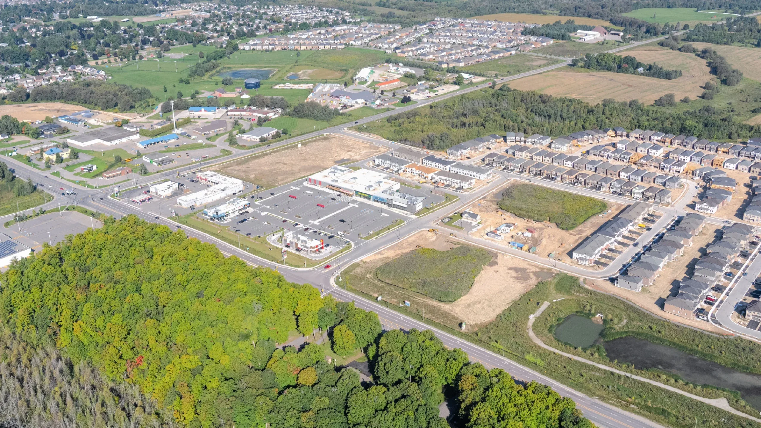 Emerald Crossing Phase I & II, Shelburne – aerial view of the plaza and a subdivision under construction