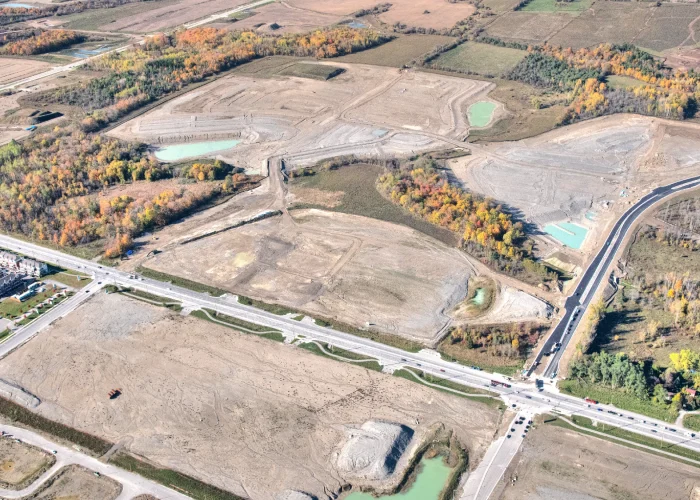 Taunton Rd & Burkholder Dr, Seaton – aerial view of the graded site with ponds and autumn trees