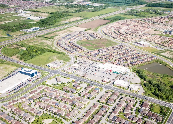 Cachet Village Phase II, Markham – aerial view of subdivisions and a plaza beside the highway