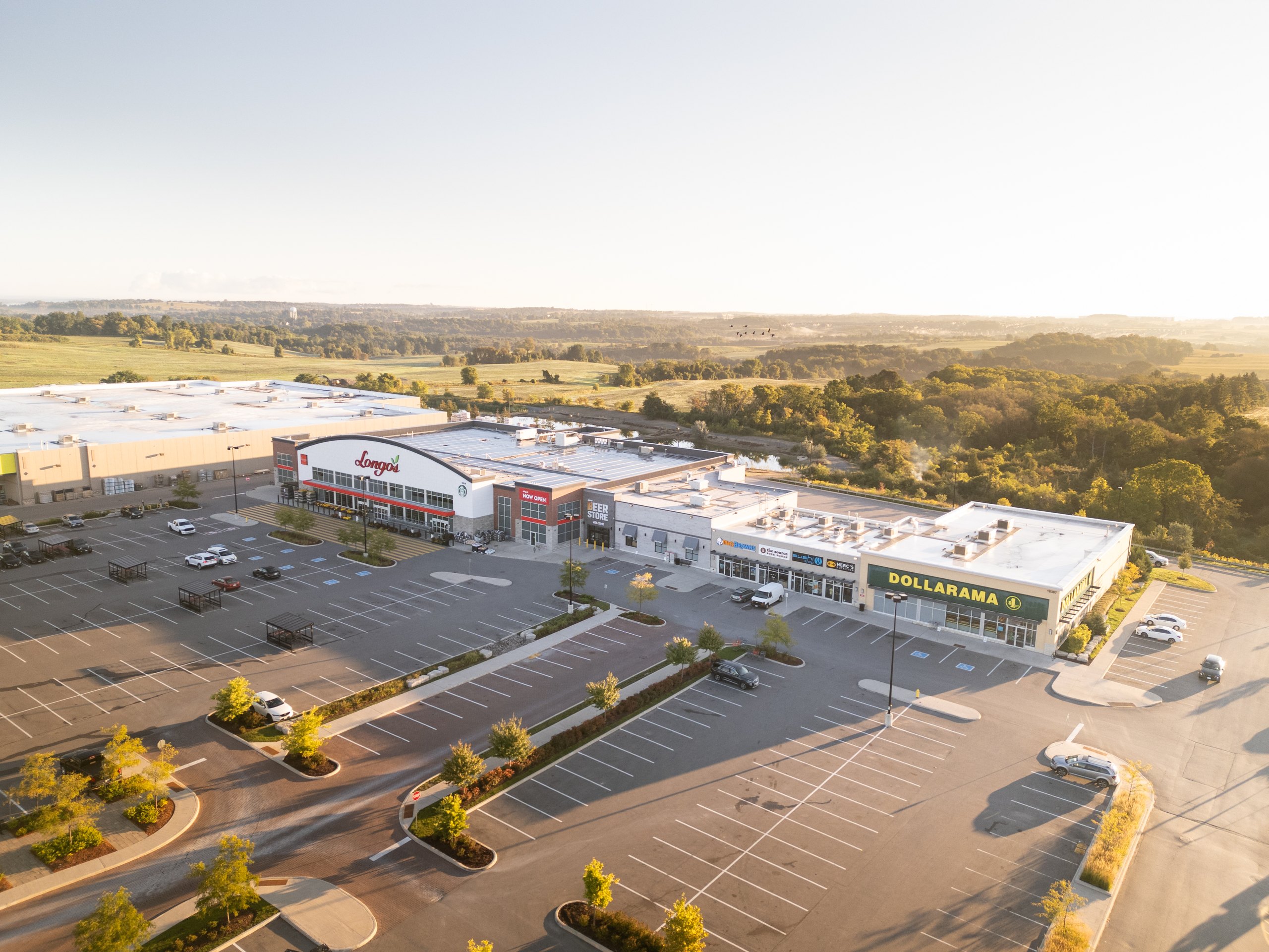 Fieldgate Commercial – aerial view of the plaza and parking lot with Longo's and Dollarama