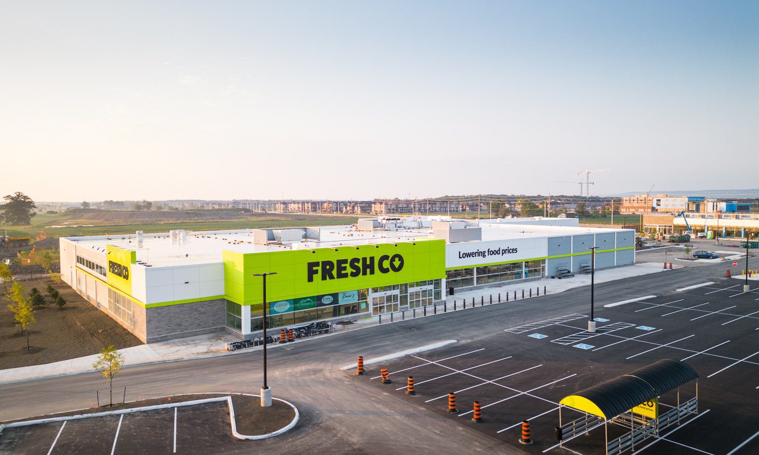 Fieldgate Commercial – aerial view of the FreshCo storefront and new parking lot