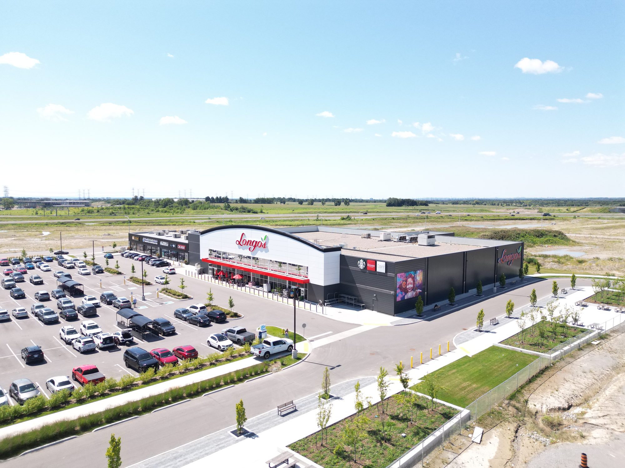 Brooklin Boroughs Phase I, Brooklin – aerial view of the Longo's storefront and full parking lot