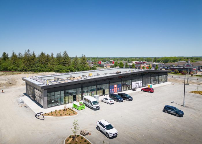Brooklin Boroughs Phase I, Brooklin – aerial view of a retail strip building with parked cars