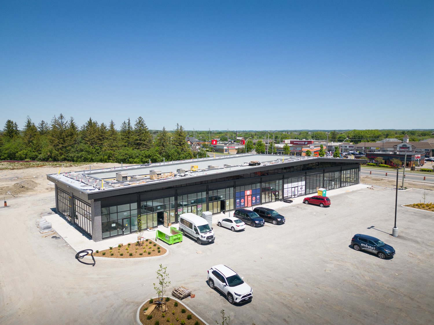 Brooklin Boroughs Phase I, Brooklin – aerial view of a retail strip building with parked cars