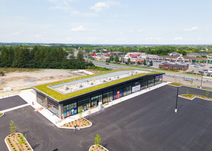 Brooklin Boroughs Phase I, Brooklin – aerial view of a green-roof retail strip and parking lot