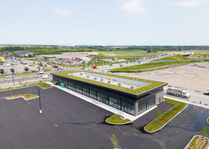 Brooklin Boroughs Phase I, Brooklin – aerial view of a green-roof retail building beside the road
