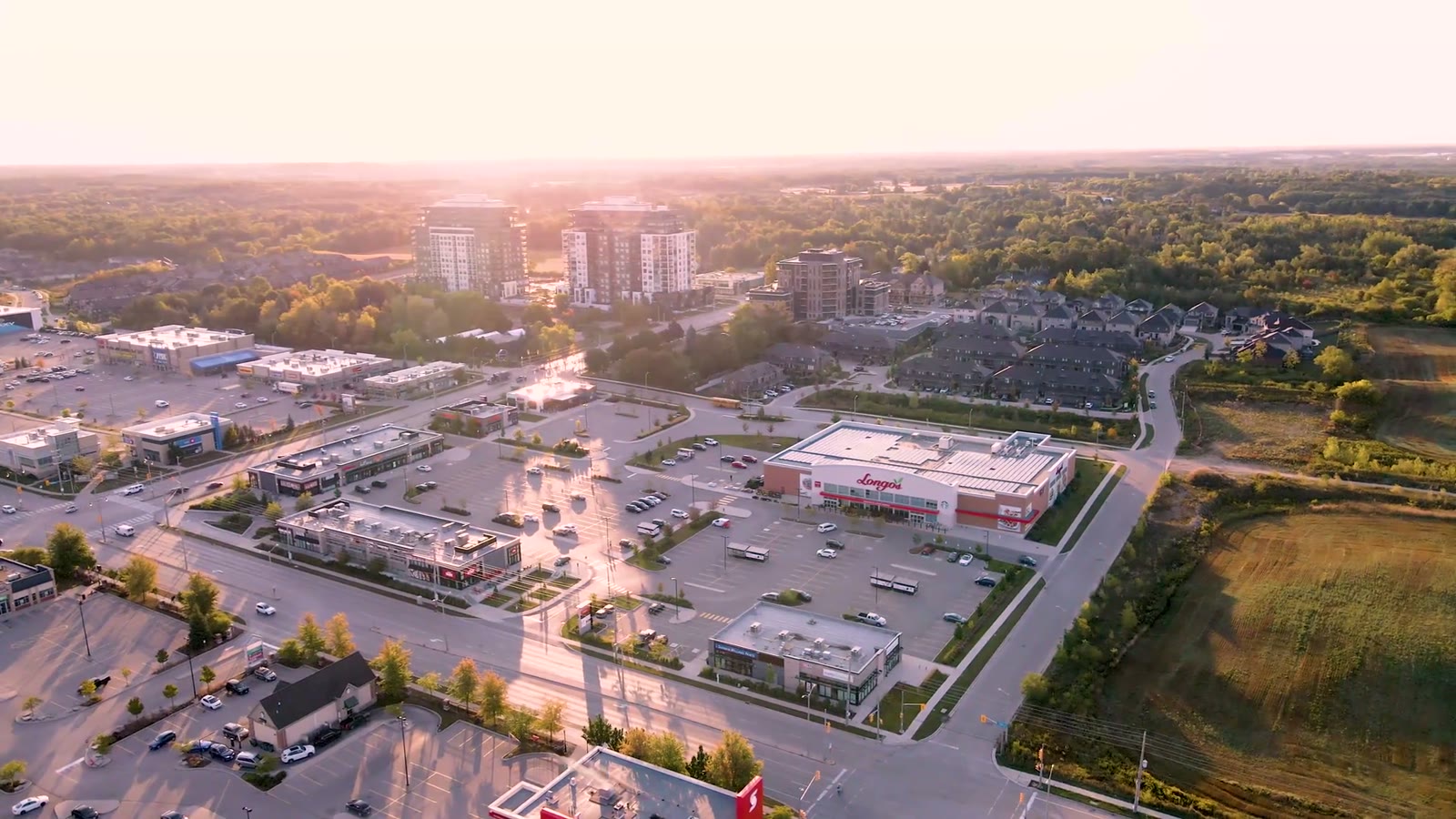 Clair Marketplace, Guelph – aerial view of the plaza and parking lot at sunset