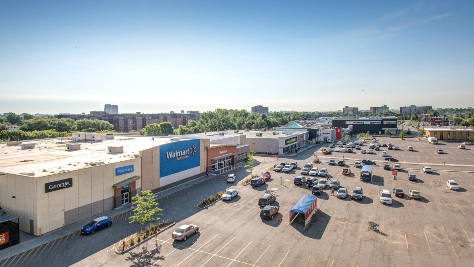 Fieldgate Properties – elevated view of the plaza parking lot with Walmart
