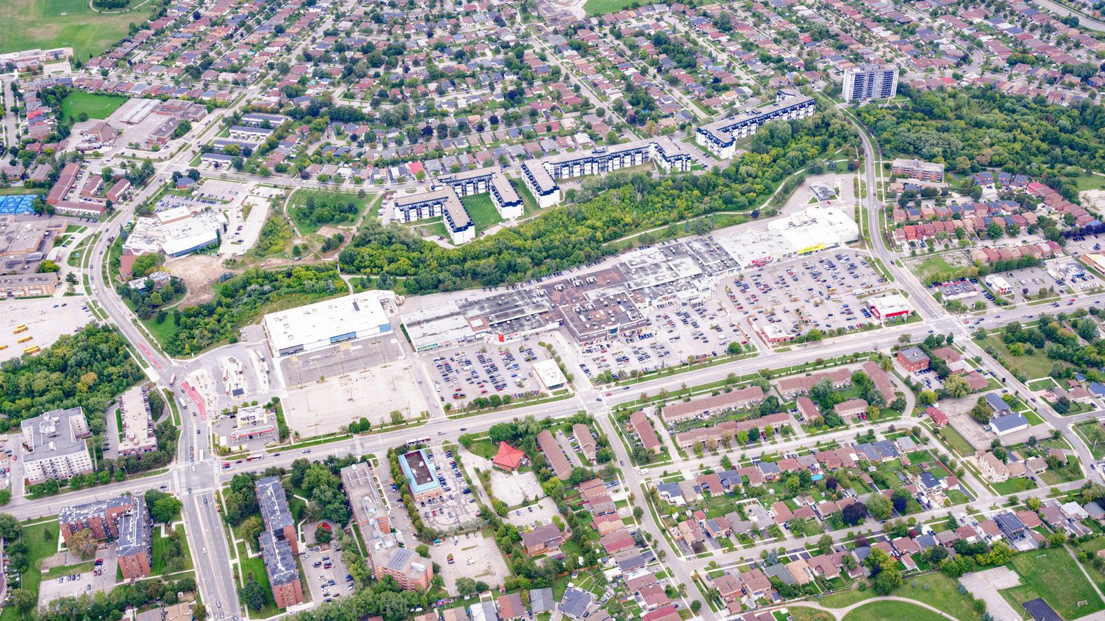 Fieldgate Commercial – aerial view of a suburban neighbourhood with a shopping plaza