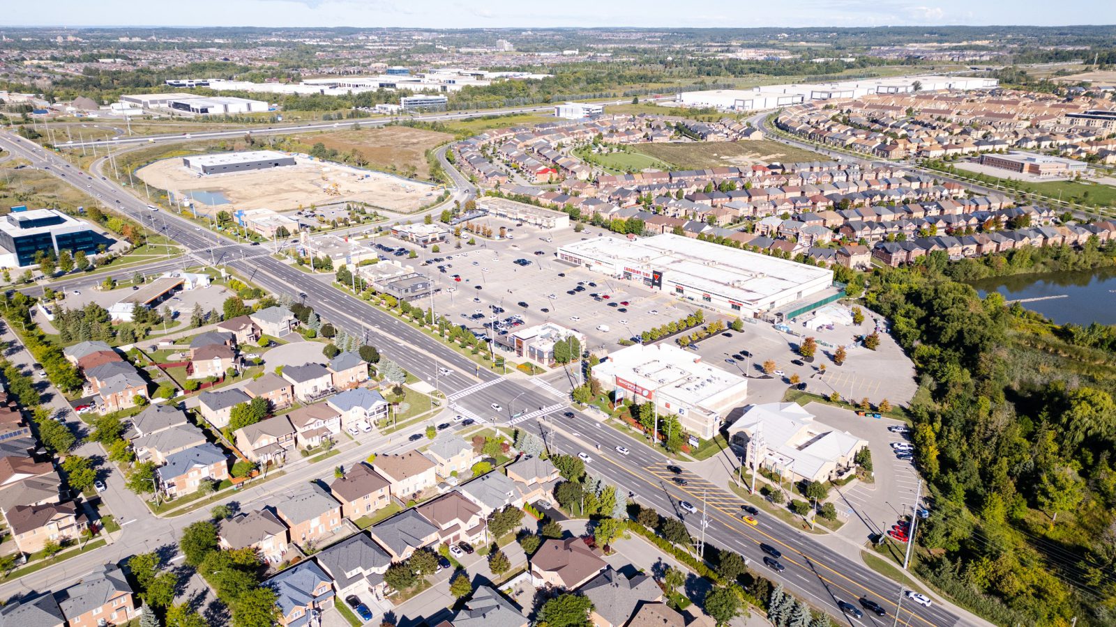 Fieldgate Commercial – aerial view of a plaza, roads and surrounding subdivision