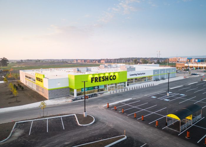 Mazmik Marketplace, Milton – aerial view of the FreshCo store and parking lot