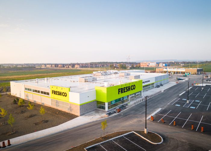 Mazmik Marketplace, Milton – aerial view of the FreshCo store and parking lot