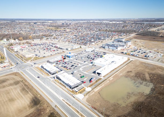 Mazmik Marketplace, Milton – aerial view of the plaza, parking lot and a stormwater pond