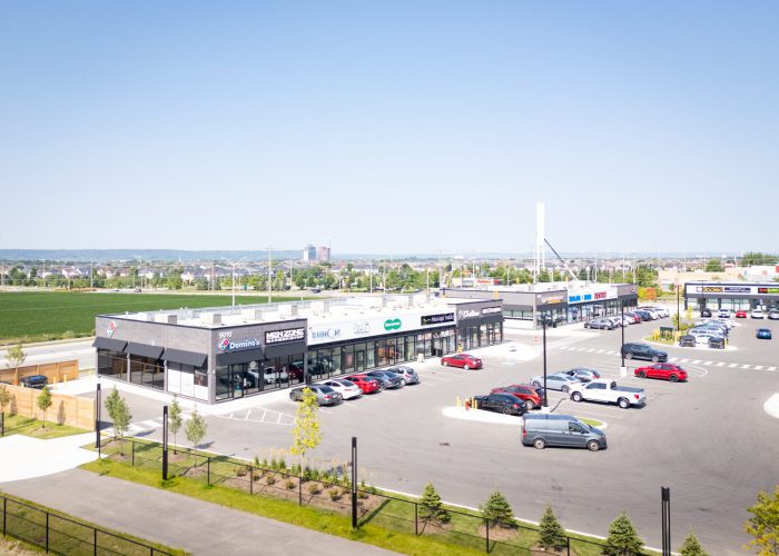 Mazmik Marketplace, Milton – elevated view of the retail strip and parking lot