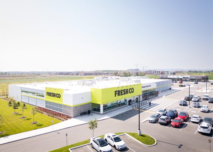Mazmik Marketplace, Milton – aerial view of the FreshCo store and parking lot