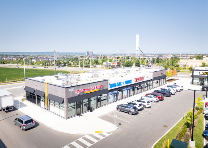 Mazmik Marketplace, Milton – aerial view of the retail row with Royal Garden and dental office