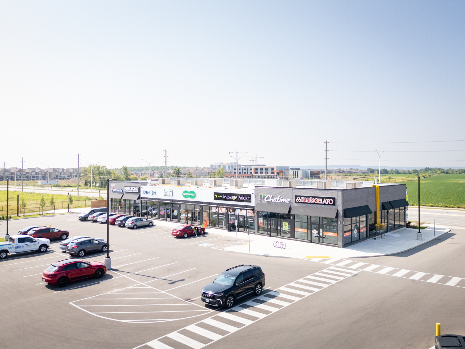 Mazmik Marketplace, Milton – aerial view of the retail row with Chatime and parking lot