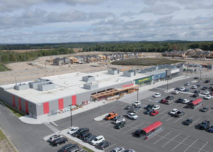 Emerald Crossing Phase I & II, Shelburne – aerial view of the plaza and parking lot with construction beyond
