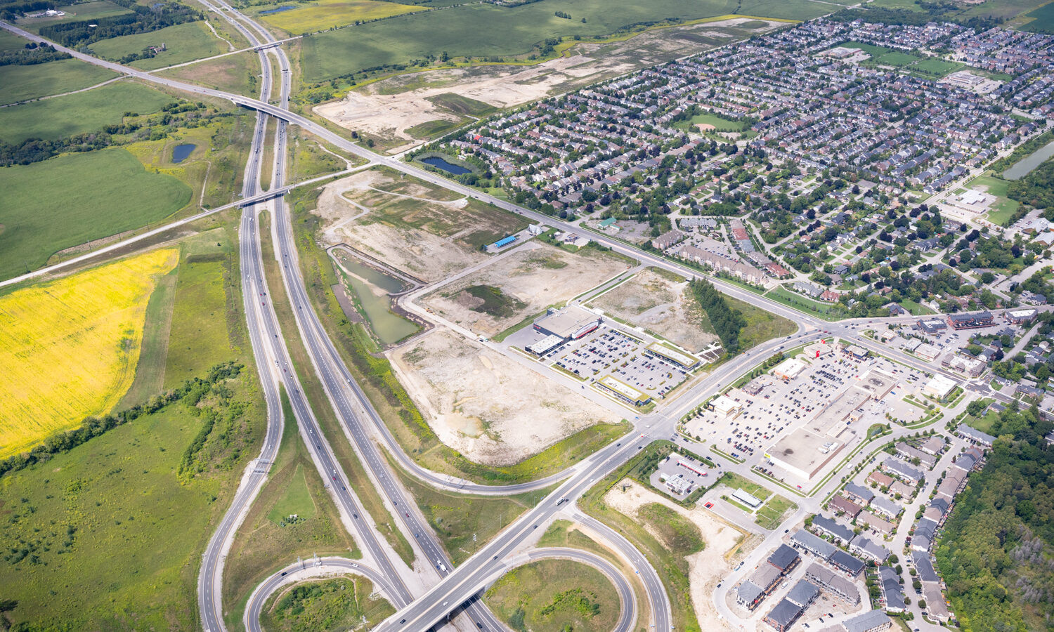Brooklin Boroughs Phase II, Brooklin – aerial view of the highway interchange, graded land and subdivision