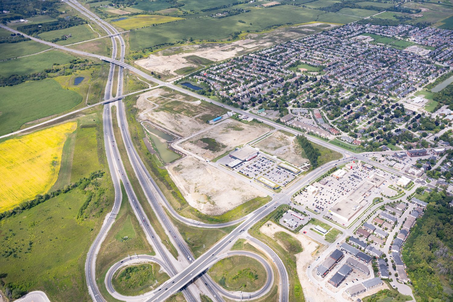 Brooklin Boroughs Phase II, Brooklin – aerial view of the highway interchange, graded land and subdivision