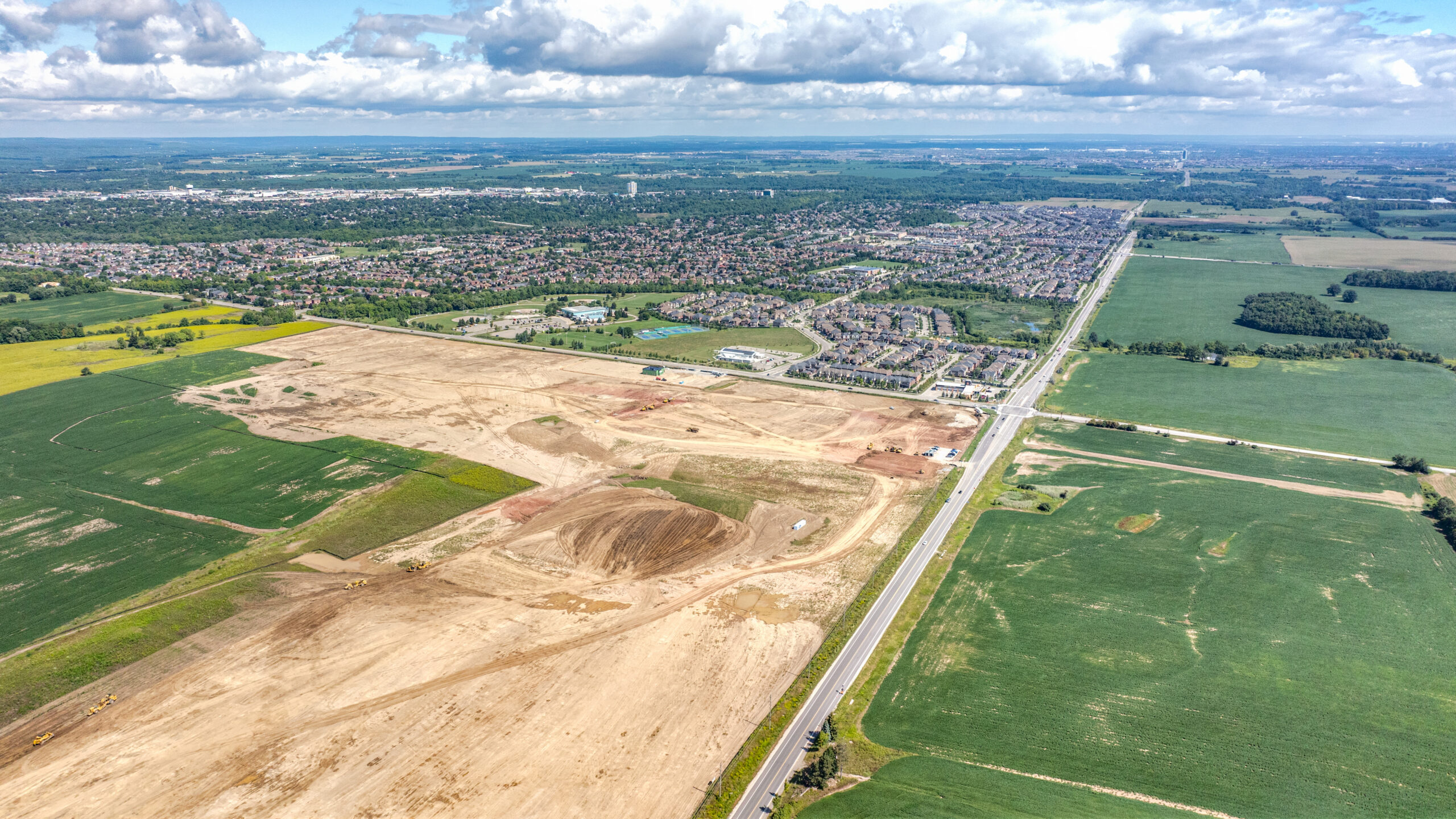 10 Side Road & 8th Line, Georgetown – aerial view of the graded site among farm fields