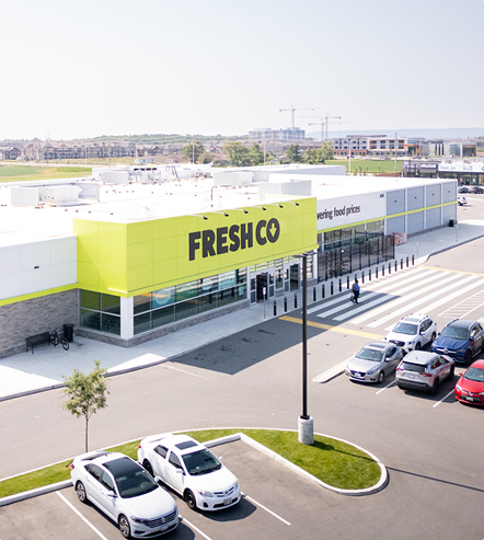 Fieldgate Commercial – FreshCo storefront with parking lot