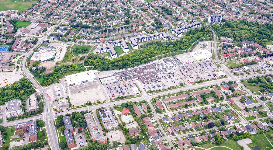 Fieldgate Commercial – aerial view of a suburban neighbourhood with a shopping plaza
