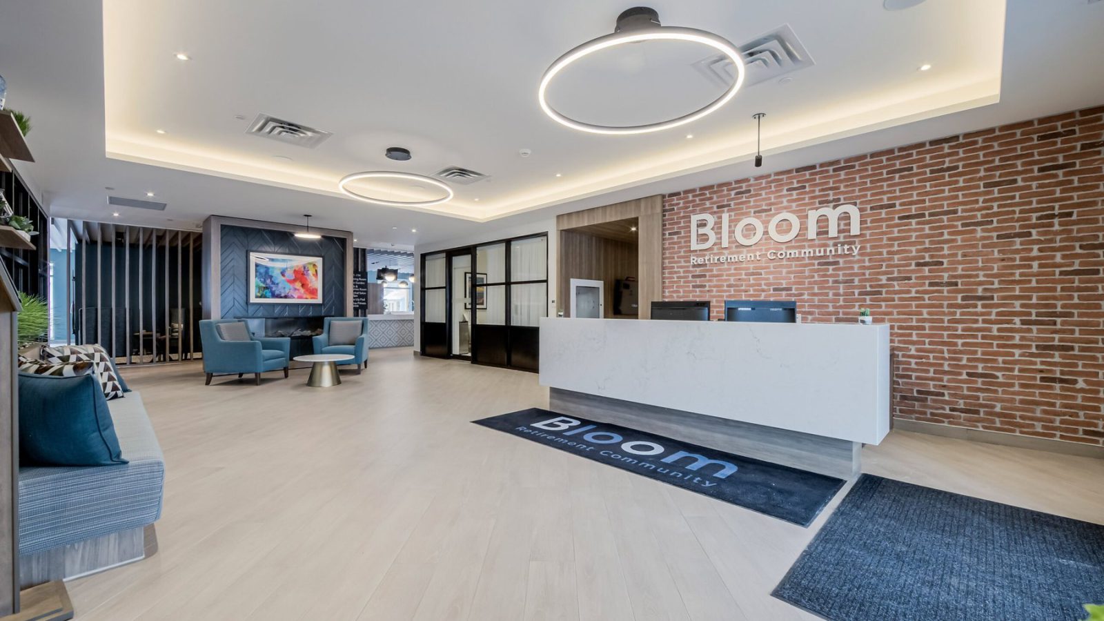 Bloom Oshawa – lobby with reception desk and Bloom signage